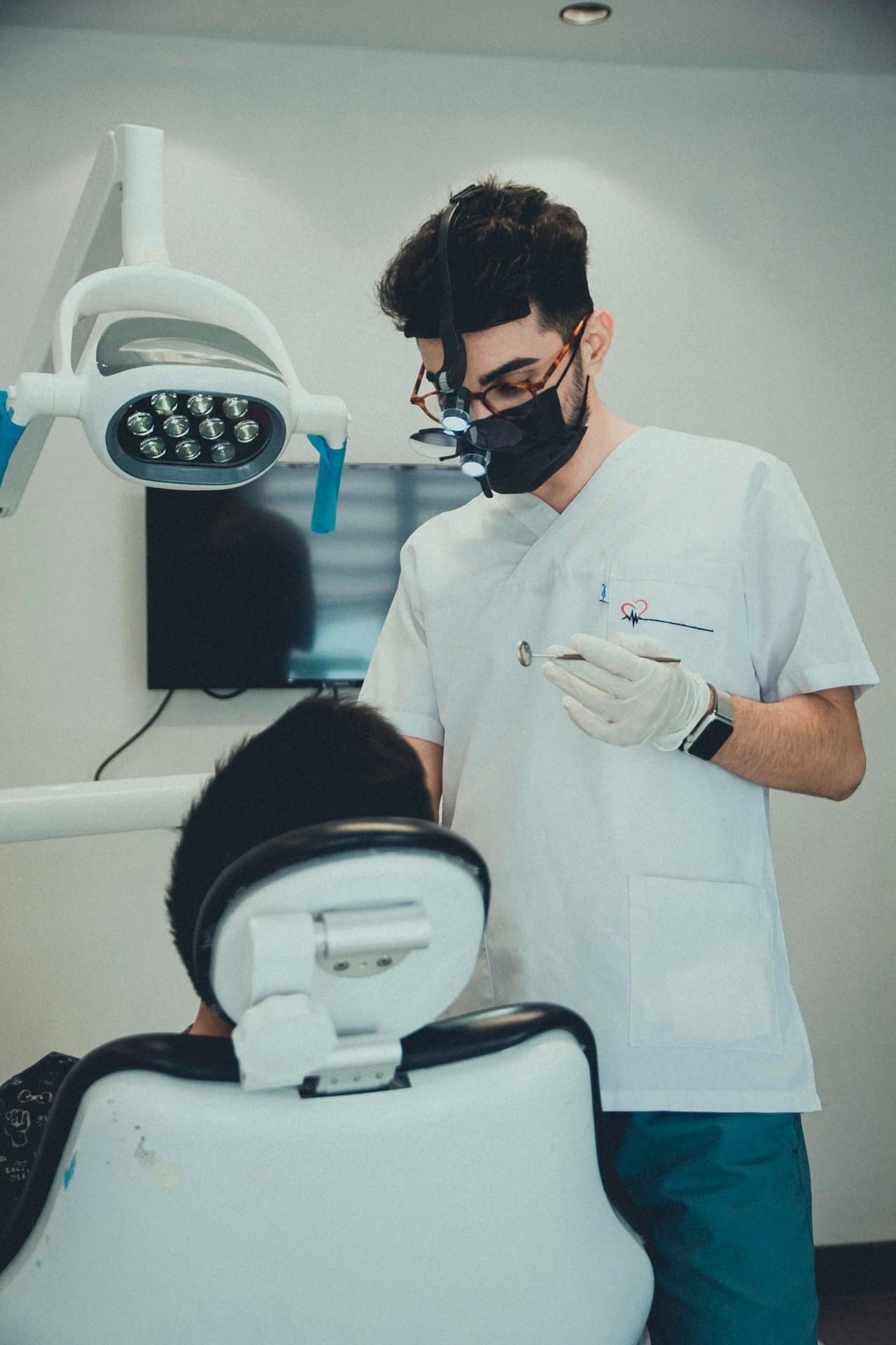 Dentist examining a patient's teeth and bite during a dental checkup