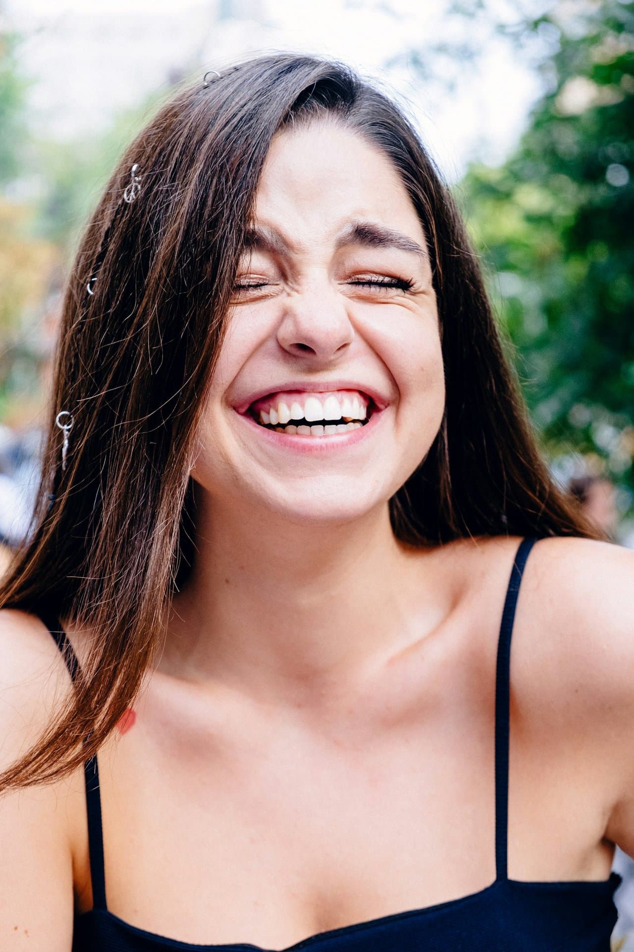 Close-up of a smile showing metal dental braces on teeth