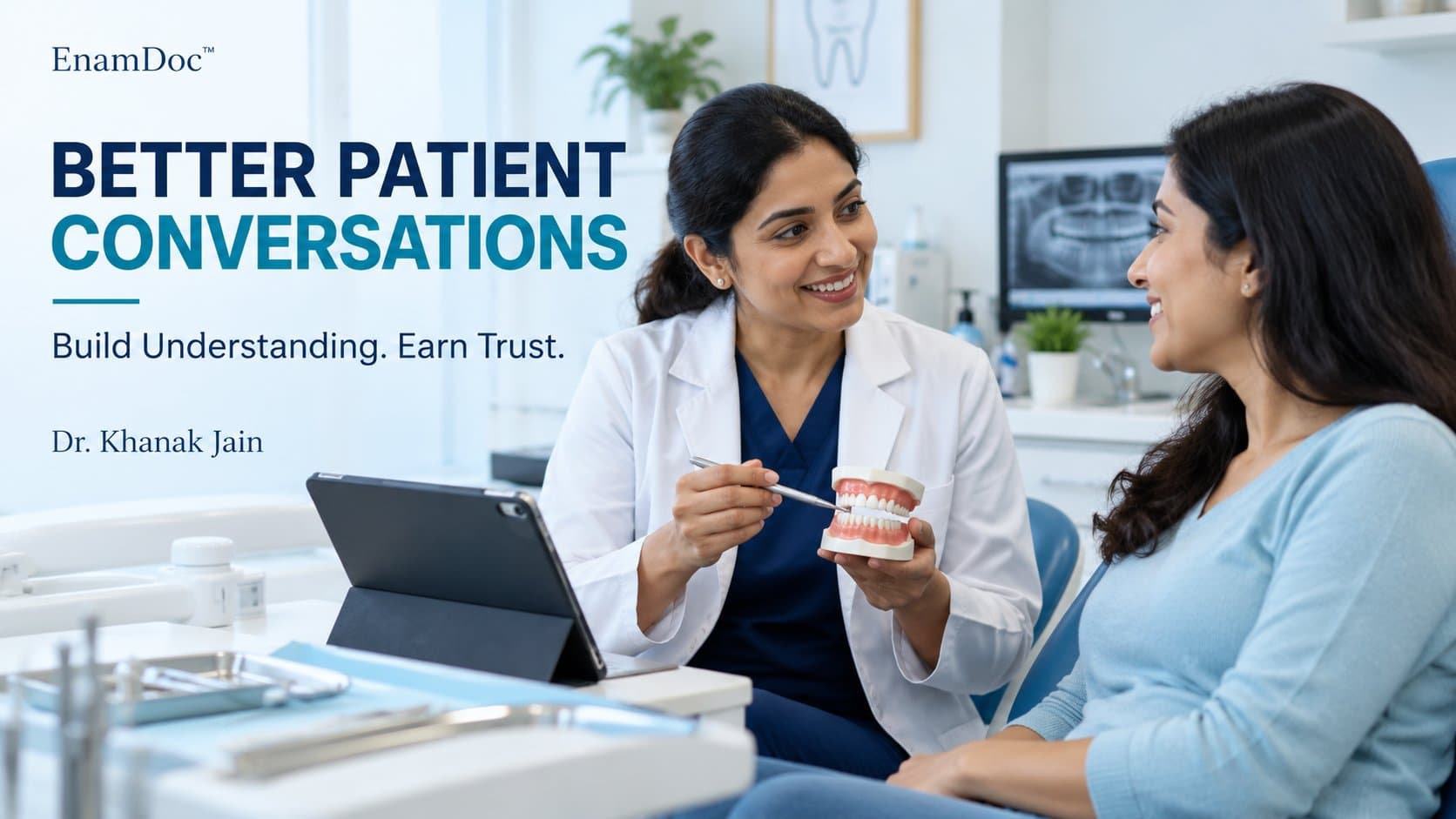 Dentist explaining dental care to an attentive patient using a dental model, with a tablet nearby.