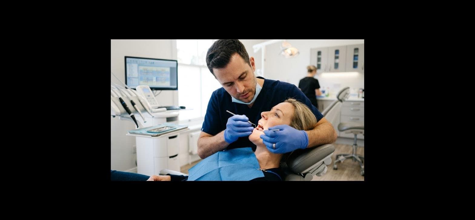 Dentist examining a patient's loose tooth in a dental clinic