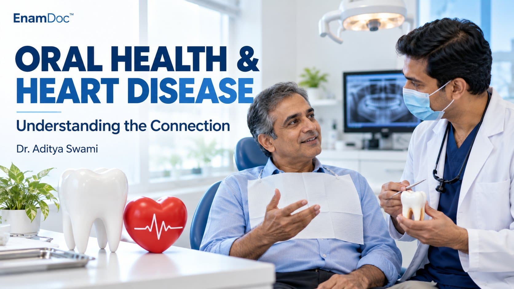Patient discussing oral health with a dentist, with tooth and heart models displayed nearby.